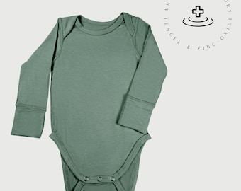 Body de manga larga para bebé: Tencel Lyocell con óxido de zinc para pieles sensibles.