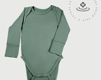 Body de manga larga para bebé: Tencel Lyocell con óxido de zinc para pieles sensibles.