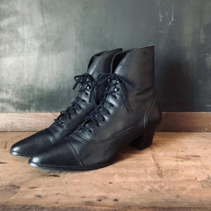 May include: A set of three ceramic vases in varying heights. The vases are white with a textured, ribbed design. The tallest vase is approximately 10 inches tall, the medium vase is 8 inches, and the smallest is 6 inches.