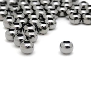 250 pcs. 3mm gunmetal colored beads for jewelry making. Tiny round iron spacer bead. Destash in bulk.  Small lot, dark silver metallic ball.