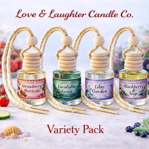May include: Variety pack of car air fresheners from Love & Laughter Candle Co. Each glass bottle has a wooden cap and a hanging cord. Scents include Strawberry Shortcake, Eucalyptus Forest, Lilac Garden, and Blackberry & Sage.