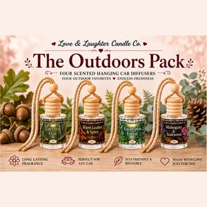 May include: Four 8ml glass car diffusers with wooden caps and braided hanging cords. Labels read Earthen Oak, Warm Leather & Spice, Eucalyptus Forest, and Mahogany & Teakwood. The set is titled The Outdoors Pack by Love & Laughter Candle Co.