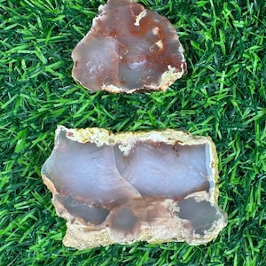 May include: A set of three ceramic mugs with a speckled, matte finish. The mugs are in shades of cream, light gray, and dark gray. Each mug has a simple, minimalist design, perfect for coffee or tea.