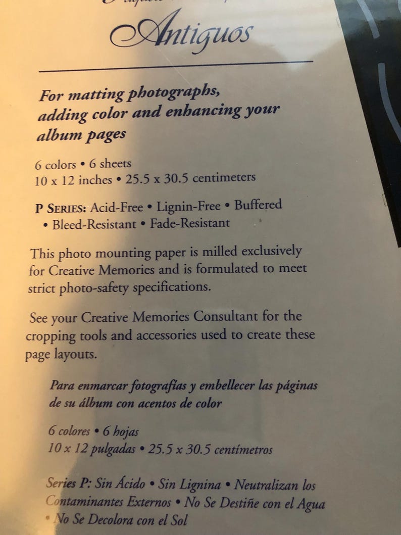 May include: A close-up of a product description for a photo mounting paper. The paper is acid-free, lignin-free, buffered, bleed-resistant, and fade-resistant. It is designed for matting photographs, adding color, and enhancing album pages. The paper is available in 6 colors and 6 sheets, measuring 10 x 12 inches or 25.5 x 30.5 centimeters.