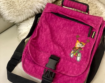 Maletín bandolera magenta con bordado de personaje de dibujos animados de monstruo de Tasmania y bolso para portátil con correa ajustable.