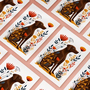 May include: A series of identical art prints featuring a brown dog sitting in a field of stylized flowers. The dog is depicted in profile, surrounded by orange, red, and dark blue botanical illustrations on a clean white background.