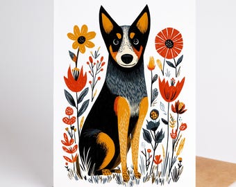 May include: A greeting card featuring a stylized illustration of a black, grey, and tan dog sitting upright. The dog is surrounded by a vibrant arrangement of orange, red, and dark grey flowers and foliage on a clean white background.