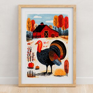 Thanksgiving turkey folk art print with a red barn and autumn trees, framed in light oak