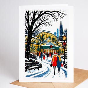 Chicago Christmas card standing upright, the glass houses of the Lincoln Park Conservatory glowing in the snow