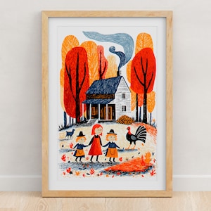 May include: A framed art print featuring a house with blue smoke rising from the chimney, surrounded by orange and red trees. In the foreground, three figures in hats and a turkey stand on a path with scattered leaves and a small blue animal.