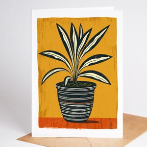 Spider plant folk art note card in a striped pot on a mustard background
