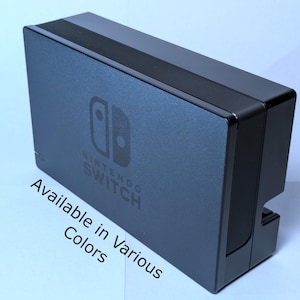 May include: A black Nintendo Switch console with the Nintendo Switch logo on the front. Available in various colors.