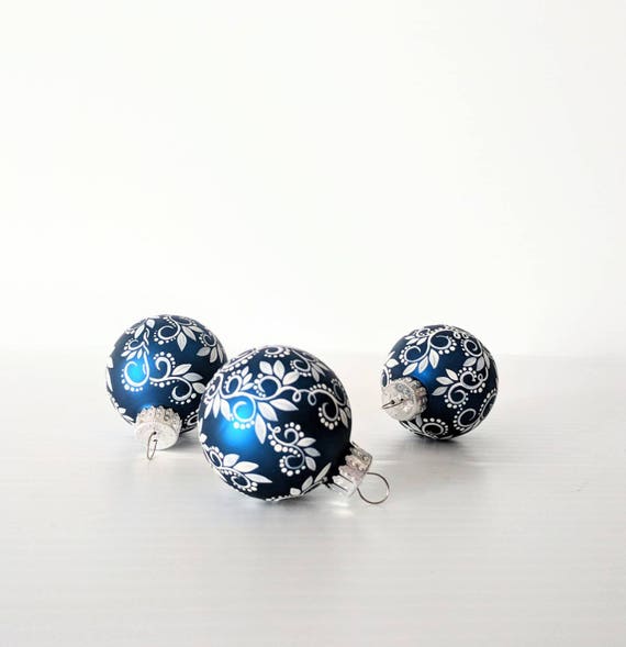 Tiny little ornaments white swirls leaves and dots on small royal blue glass ornaments