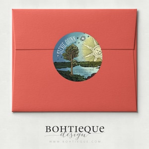 May include: A round sticker with a vintage illustration of a tree, sun, and moon. The sticker has the text "STEVIE QUINN" and an address. The sticker is on a red envelope.