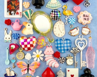 An Alice in Wonderland Collection of Charms, Beads, and Miniature Trinkets