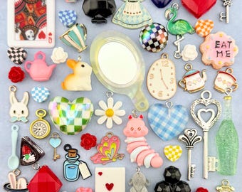 An Alice in Wonderland Collection of Charms, Beads, and Miniature Trinkets