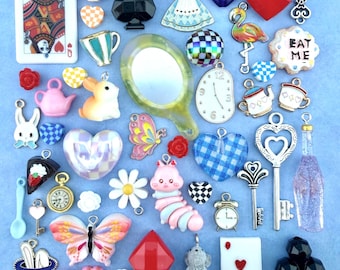 An Alice in Wonderland Collection of Charms, Beads, and Miniature Trinkets