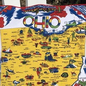 May include: A colorful vintage map of Ohio with illustrations of various industries and landmarks. The map is on a yellow background with red, blue, and green accents. The state's name is written in large, colorful letters at the top of the map.