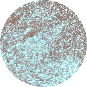 May include: A close-up of a light blue glitter with a shimmery finish. The glitter is made up of small, round particles that create a sparkling effect.