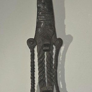 This is a metal sculpture, possibly an oil lamp or ladle from the Persian Safavid