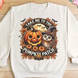 May include: White sweatshirt with a graphic print of a pumpkin, owl, and the text "Take Me To The Pumpkin Patch 2034".