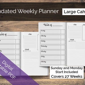 May include: A black and white printable weekly planner with the text "Undated Weekly Planner Large Cahier" at the top. The planner has a section for each day of the week, a section for tasks, and a section for habits. The text "Week of" is at the top of the planner, and the text "Sunday and Monday Start Included Covers 27 Weeks" is at the bottom.