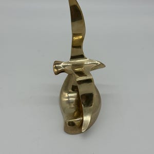Vintage brass bird in flight sculpture