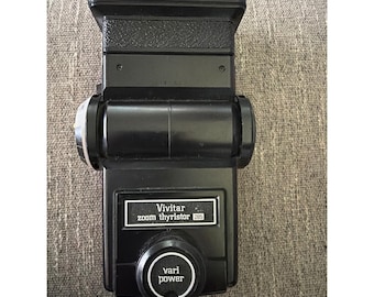Flash electrónico vintage Vivitar 285 Zoom Thyristor para cámara, color negro.