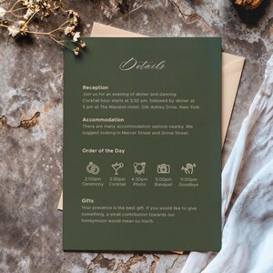 May include: A dark green wedding invitation with elegant script and event details. The invitation includes information about the reception, accommodation, order of the day, and gift preferences. The invitation is placed on a textured surface with floral accents.