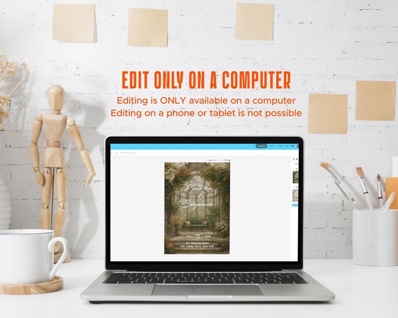 May include: A laptop displaying a wedding invitation design with a floral arch and the names "Vanessa & Benjamin." The text "EDIT ONLY ON A COMPUTER" is above the laptop. A wooden artist's mannequin, a mug, and art supplies are on the desk.