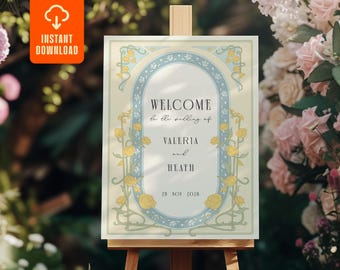 Pode incluir: Uma placa de boas-vindas de casamento em um cavalete de madeira. A placa tem um fundo creme com um design floral azul claro e amarelo. O texto diz "WELCOME to the wedding of VALERIA and HEATH 28 NOV 2020". Um ícone laranja de "DOWNLOAD INSTANTÂNEO" está no canto superior esquerdo.