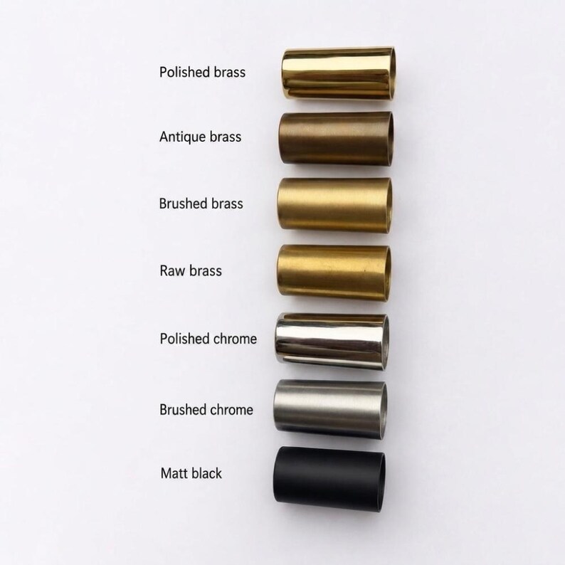 May include: A vertical column of seven cylindrical metal sleeves in various finishes, labeled from top to bottom: Polished brass, Antique brass, Brushed brass, Raw brass, Polished chrome, Brushed chrome, and Matt black. Each sleeve is identical in shape.