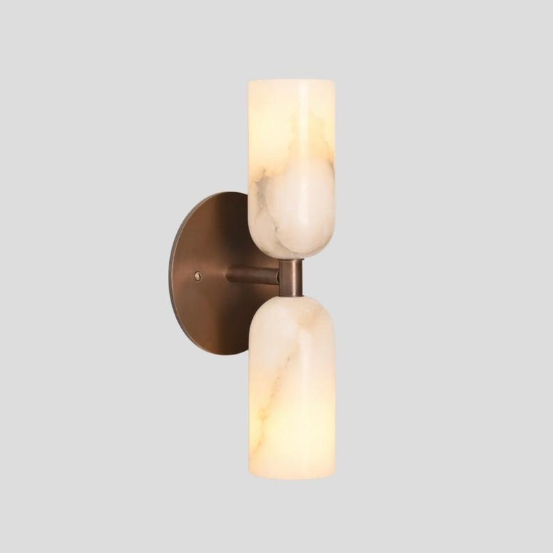 Double alabaster wall light with warm ambient glow