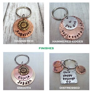 May include: Four different styles of personalised keychains with a sunflower design. The keychains are made of metal and have a hammered, hammered edges, smooth, and distressed finish.