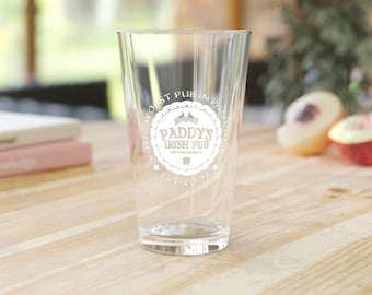 May include: A clear glass pint glass with a white logo that reads "Paddy's Irish Pub" and "Voted Worst Pub in Philadelphia" with a shamrock and two flags.  Est. 2008.