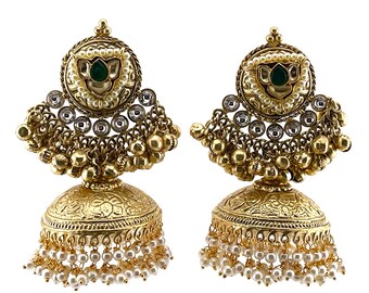 May include: A pair of gold-tone earrings with a round, ornate design. The earrings feature a green stone, white pearls, and clear rhinestones. The earrings have a dangling bell-shaped bottom with a fringe of white pearls.