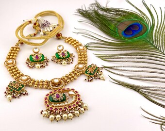Necklace with Red and Green Stone in Golden Finish