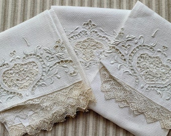 Three beautiful antique white hand towels.
