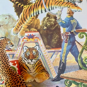 May include: Vintage circus poster featuring a tiger leaping through a hoop held by a ringmaster in a blue uniform. Other animals include a lion, bear, and leopard. The poster has a colorful, illustrative style.