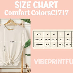 May include: A cream-colored t-shirt displayed on a wooden rack, with a size chart and the text "SIZE CHART Comfort Colors C1717" in the background. The chart shows width and length measurements in inches.