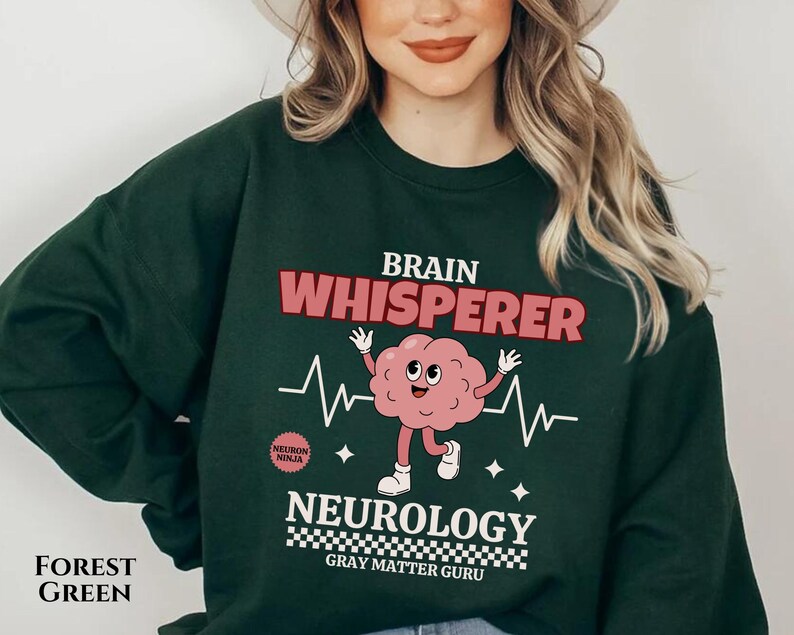 May include: Forest green sweatshirt with a brain graphic and the text "Brain Whisperer Neurology Gray Matter Guru".