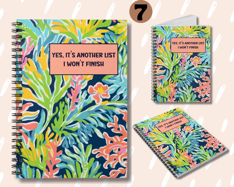 May include: A spiral bound notebook with a colorful floral pattern and the text "YES, IT'S ANOTHER LIST I WON'T FINISH" on the front cover.