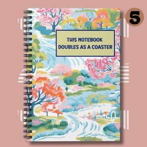 May include: A spiral bound notebook with a colorful floral design and a white background. The cover features the text "This notebook doubles as a coaster."