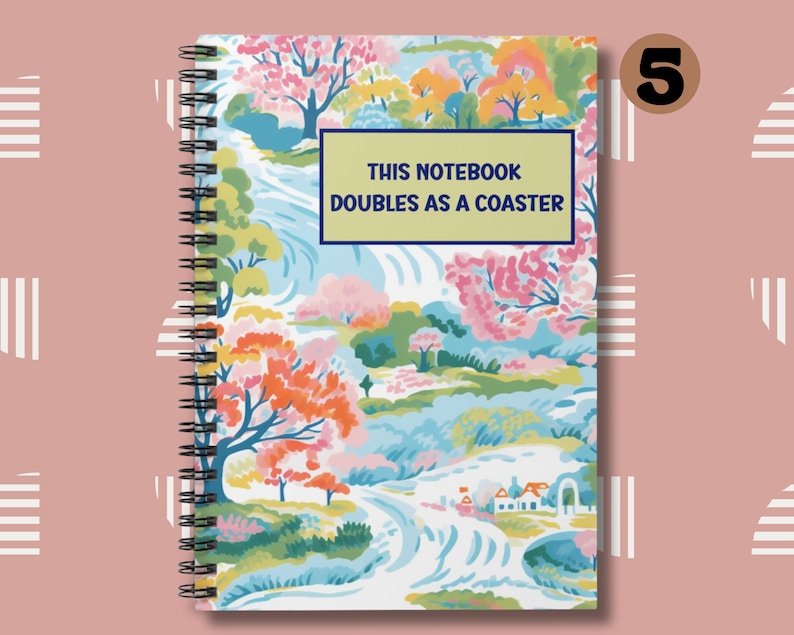 May include: A spiral bound notebook with a colorful floral design and a white background. The cover features the text "This notebook doubles as a coaster."