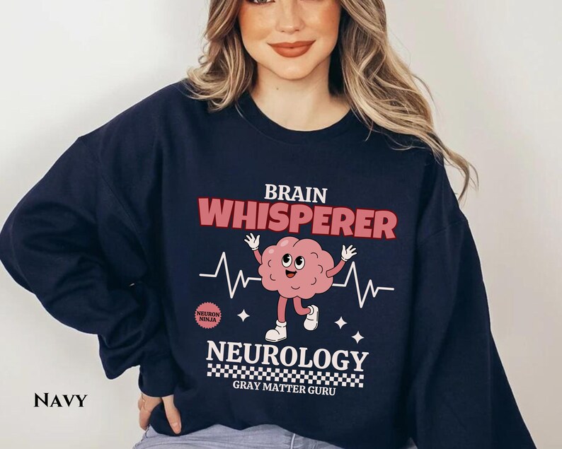 May include: Navy blue sweatshirt with a brain graphic and the text "Brain Whisperer Neurology Gray Matter Guru".