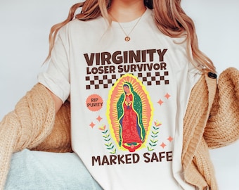 May include: White t-shirt with brown text that reads "Virginity Loser Survivor" with a checkered pattern and a graphic of the Virgin Mary with the text "RIP Purity" and "Marked Safe".