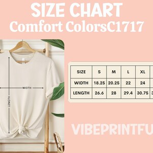 May include: Cream-colored t-shirt displayed on a wooden rack, with a size chart showing width and length measurements in inches. The text "SIZE CHART Comfort Colors C1717" is at the top, and "VIBEPRINTFUN" is at the bottom.