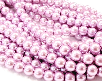 May include: A strand of light purple pearl beads. The beads are round and have a smooth, glossy finish.