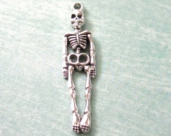 2 Skeleton Charms in Antique Silver, full length skeleton 39x9mm C23-004