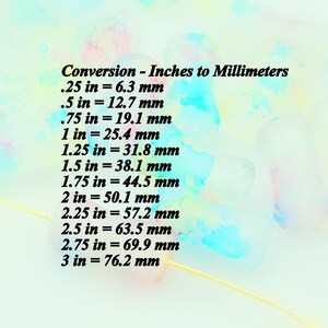 May include: A conversion chart showing the equivalent measurements in millimeters for various inch measurements, from 0.25 inches to 3 inches. The chart is written in black text on a light blue background with yellow and pink watercolor accents.